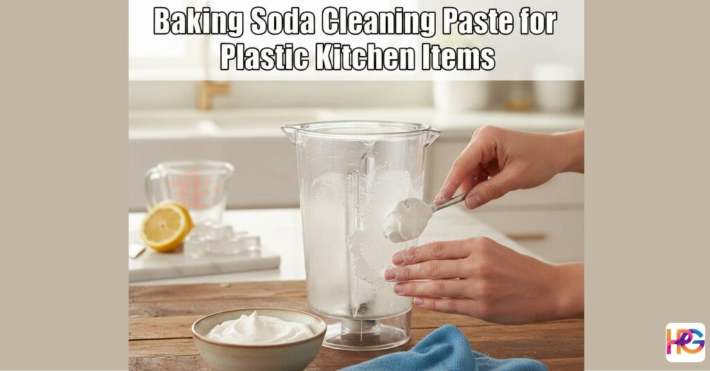 A person applies a thick baking soda cleaning paste for plastic kitchen items to a foggy blender jar on a sunny kitchen counter.