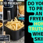 A side-by-side comparison of two air fryer baskets filled with french fries, labeled Batch A Preheated (crispy and golden) and Batch B Cold Start (paler), illustrating if you need to preheat an air fryer.