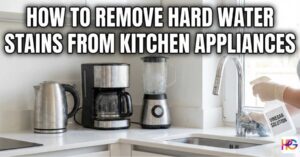 A person scrubbing hard water stains from a cloudy glass pitcher using a small brush and baking soda.