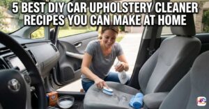 A woman inside a car using a spray bottle and scrub brush to apply one of the 5 Best DIY Car Upholstery Cleaner Recipes You Can Make at Home to a stained gray seat.