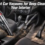 A man in a driveway using a powerful deep cleaning vacuum for car to remove heavy dust and debris from floor mats.