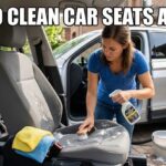 Woman scrubbing a grey cloth car seat with soapy water and a brush, illustrating how to clean car seats at home.