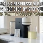 A Nespresso Vertuo machine on a kitchen counter with a packet of descaling solution and a glass container of liquid for a beginner step-by-step guide.