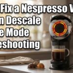 A Nespresso Vertuo coffee maker with a red flashing light on a kitchen counter, with text about how to fix a Nespresso Vertuo stuck in descale mode.