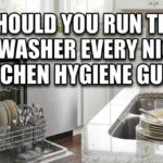 A modern kitchen with an open, loaded dishwasher and a sink with dirty dishes, featuring the text overlay: "Should You Run the Dishwasher Every Night? Kitchen Hygiene Guide."