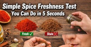 Kitchen scene with jars of colorful spices on a wooden counter and bold Impact font text reading “Simple Spice Freshness Test You Can Do in 5 Seconds.”