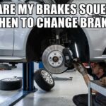 A mechanic inspecting a car on a lift in a garage with the text "Why are my brakes squeaking (And When to Change Brake Pads)" in white Impact font.