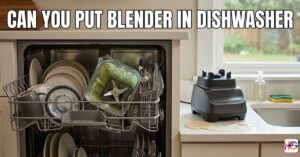 A dirty blender pitcher with green smoothie residue sitting on the top rack of an open dishwasher next to plates and mugs. The motor base sits on a white kitchen counter near a batter spill, with bold white text at the top asking, "CAN YOU PUT BLENDER IN DISHWASHER."