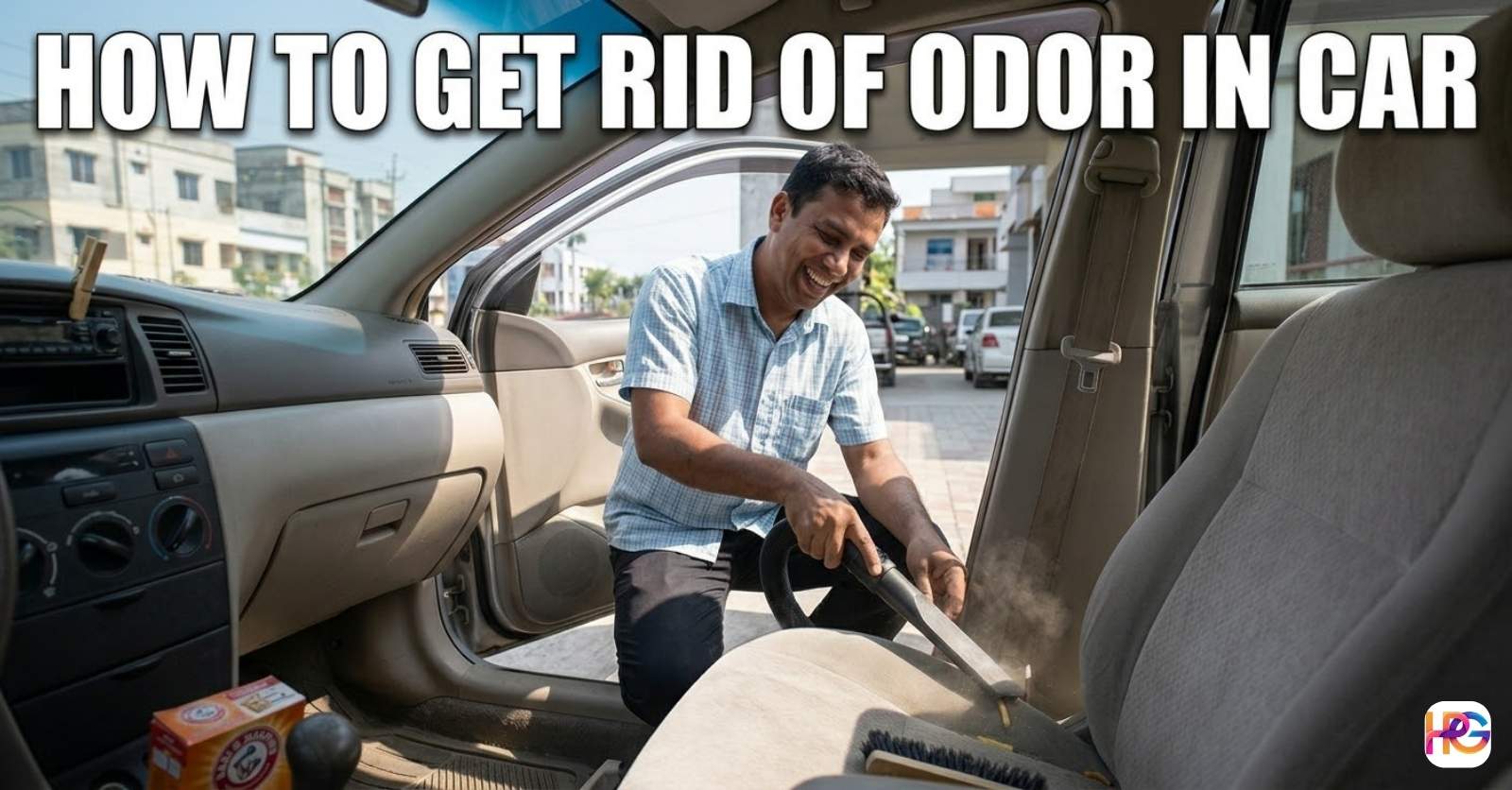 Man vacuuming a car seat to show how to get rid of odor in car using baking soda and a brush.