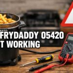 Presto FryDaddy 05420 deep fryer not working on kitchen table with fries, warning sign, multimeter, screwdriver, and damaged power plug showing troubleshooting concept.