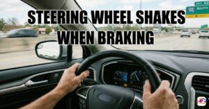 A person holds a steering wheel tightly on a busy highway with big text that says steering wheel shakes when braking.