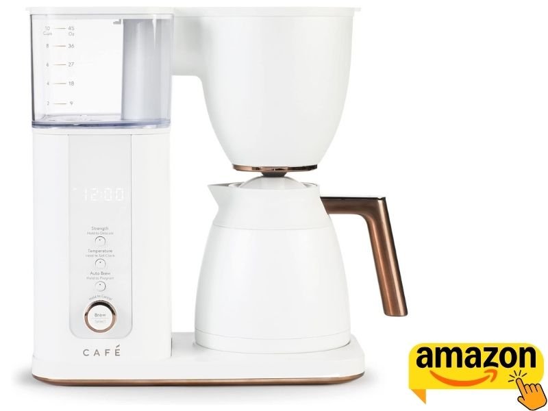Café Specialty Drip Coffee Maker in matte white with copper/bronze accents, clear water reservoir, digital control panel, and thermal carafe.