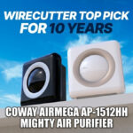 A black and a white Coway Airmega AP-1512HH air purifier under a blue sky.