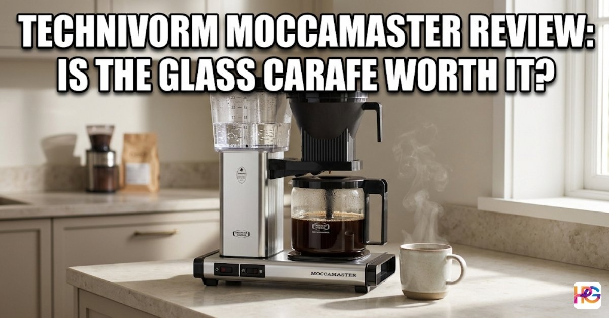 A silver coffee machine sits on a white counter. It has a glass pot with dark coffee inside. Large white text asks if the glass carafe is worth it.