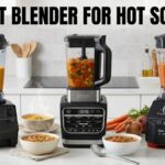 Three leading kitchen blenders—Vitamix, Ninja Foodi, and Oster Versa—sit on a counter with bowls of steaming soup to help you find the best blender for hot soup.