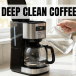 An instructional image showing a person pouring clear liquid from a glass pitcher into the water reservoir of a drip coffee maker. A bottle of white vinegar is visible on the counter nearby. Across the top, a headline banner reads: HOW TO DEEP CLEAN COFFEE MAKER.