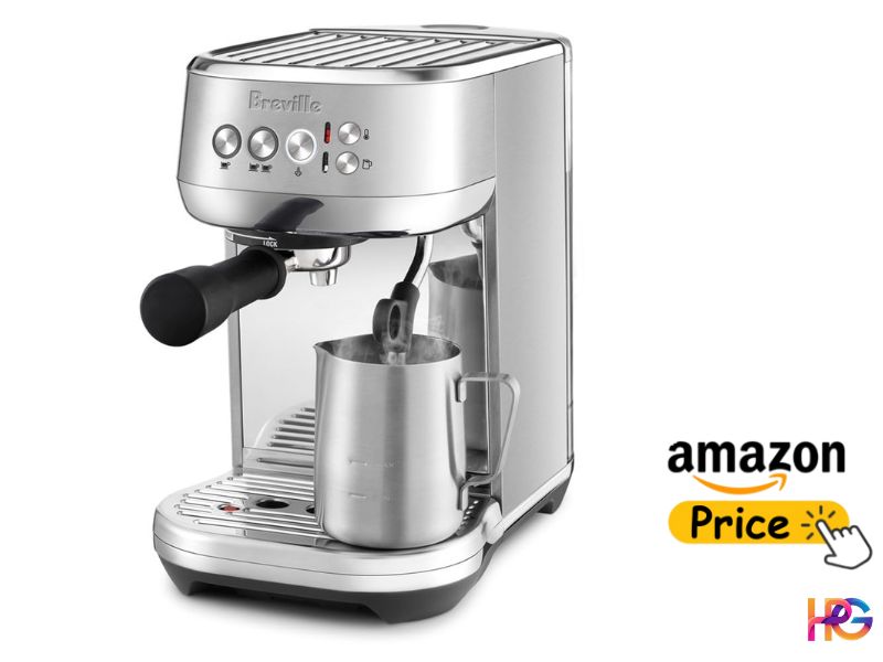Stainless steel Breville Bambino Plus espresso machine with a milk jug under the automatic steam wand.