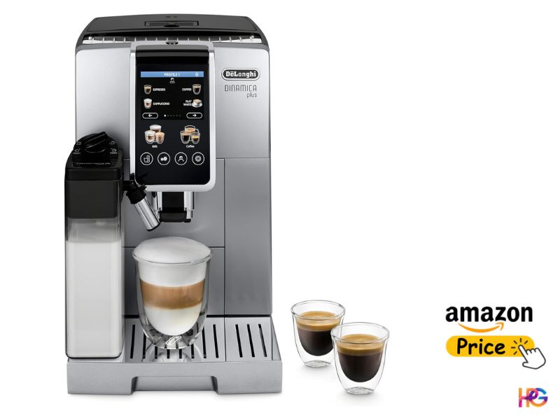 A slightly angled, front view of a silver De'Longhi Dinamica Plus automatic espresso machine on a white background. The machine has a large vertically oriented touchscreen displaying various coffee options. On the right, two small espresso cups with crema are on the drip tray. A large latte with layered milk and foam is centered in a glass mug. A milk carafe and spout are on the left.