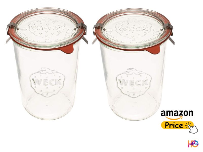Two tall, clear glass Weck jars with round glass lids, natural rubber sealing rings, and stainless steel tension clips on a white background.