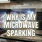 A silver microwave on a kitchen counter with its door open, showing bright blue electrical sparks inside. Bold white text in the center asks, "WHY IS MY MICROWAVE SPARKING".
