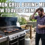 A confused man standing next to a smoking gas grill on a backyard patio, highlighting grill buying mistakes.