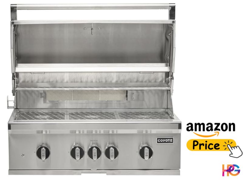 A high-end Coyote brand 50-inch built-in stainless steel grill with its lid open, showing internal grates and a warming rack. An Amazon price button graphic sits in the bottom right corner.