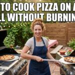 A smiling American woman in a denim apron standing between two large gas grills in a backyard. She is using a metal pizza peel to move a pizza. Bold, white text at the top reads "HOW TO COOK PIZZA ON A GAS GRILL WITHOUT BURNING IT" in a classic meme-style Impact font.