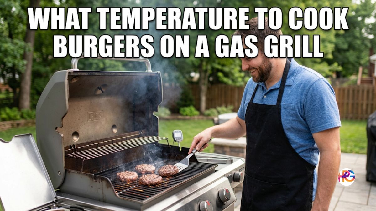 A smiling Caucasian man in a blue polo shirt and black apron cooks burgers on a modern Weber gas grill in a backyard. Large white Impact font text across the top reads: "WHAT TEMPERATURE TO COOK BURGERS ON A GAS GRILL".