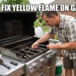 A man cleans a gas grill's burner tubes with a venturi brush, performing maintenance to resolve a yellow flame problem, with the text "HOW TO FIX YELLOW FLAME ON GAS GRILL" at the top.