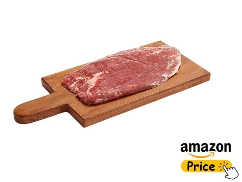 A raw, flat flank steak displaying distinct long muscle fibers resting on a wooden paddle-style cutting board with a handle.