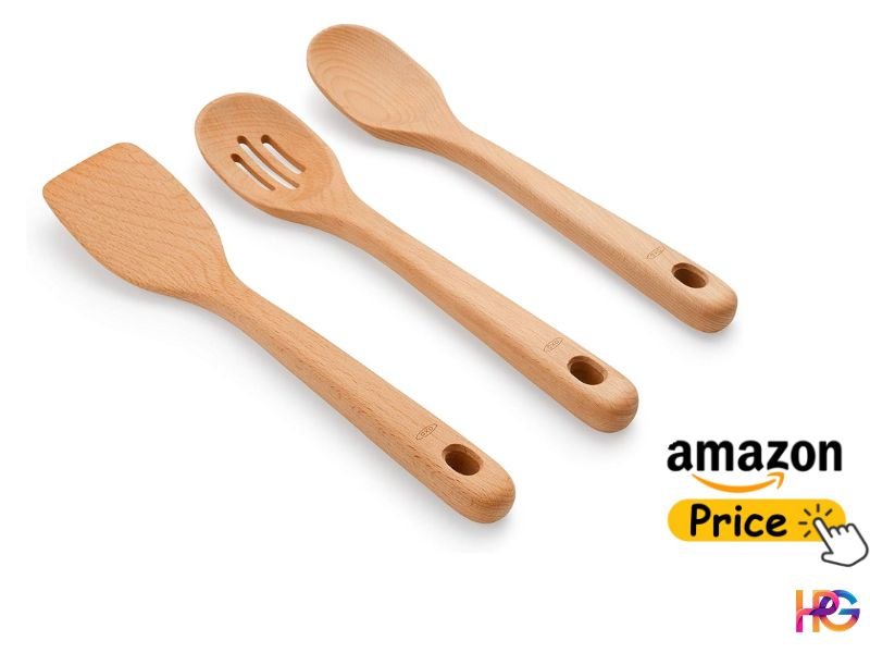 A simple three-piece wooden kitchen utensil set consisting of a flat turner spatula, a slotted spoon, and a large solid mixing spoon made of smooth beechwood on a white surface.