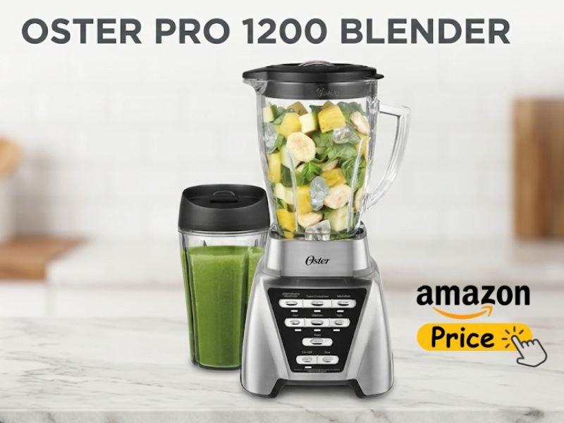 An Oster Pro 1200 Blender with a glass jar filled with fruits and spinach sits on a marble countertop next to a filled travel cup, featuring dark text reading "OSTER PRO 1200 BLENDER" at the top and an "amazon Price" button icon in the bottom right corner.