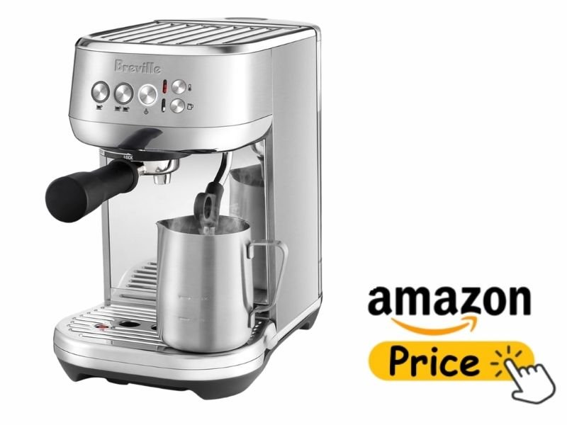 Stainless steel Breville Bambino Plus espresso machine steaming milk in a stainless steel pitcher placed on the drip tray.