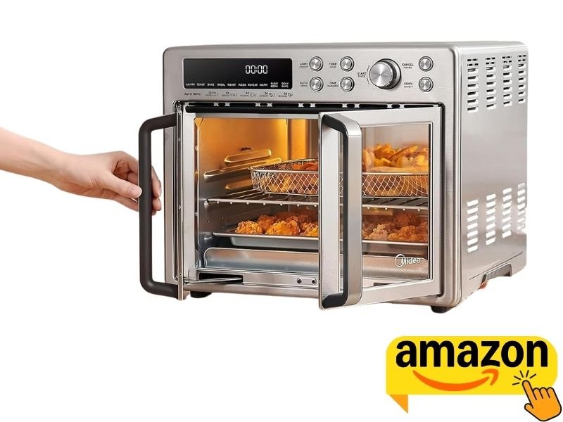 Hand opening the stainless steel French door of a Midea air fryer oven filled with fries and fried chicken.