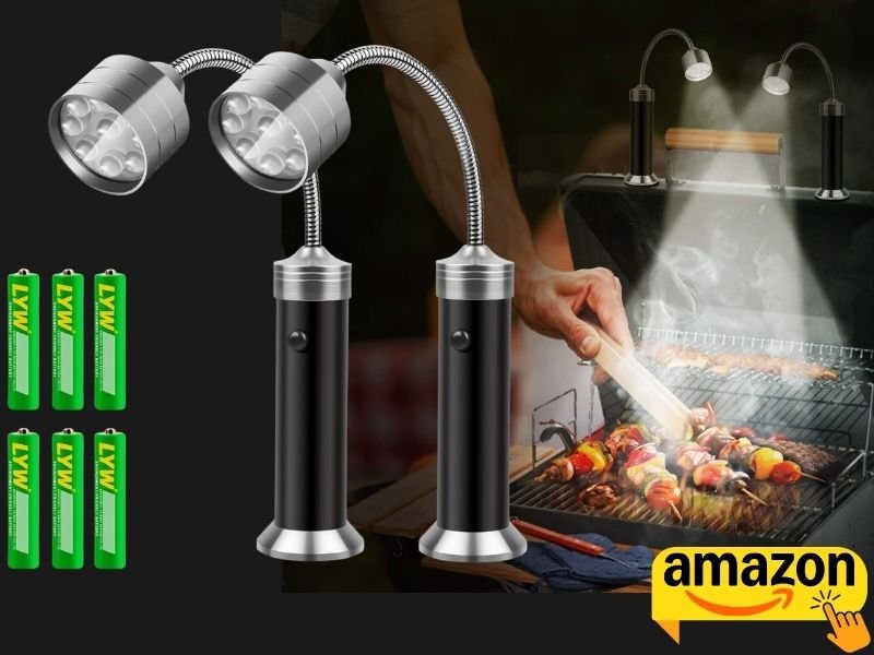 Kosin Grill Light with flexible necks illuminating an outdoor barbecue.