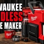 Milwaukee cordless coffee maker with a portable battery-powered brewing system, travel mug, coffee grinder, reusable filter, charging cable, and accessories displayed on a workshop-style countertop.